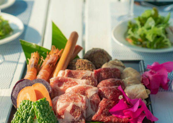 A meat and seafood platter at ocean good table Ishigaki, looking especially fresh and vibrant.